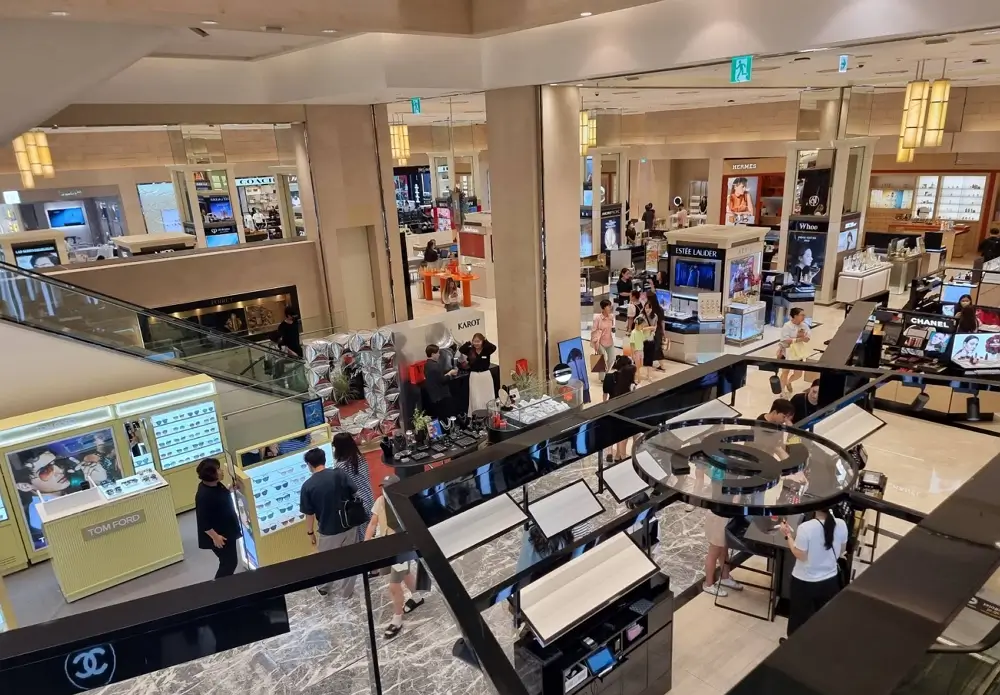 High-end luxury K-beauty and international cosmetic counters at the ground floor of Shinsegae Department Store in Seoul.