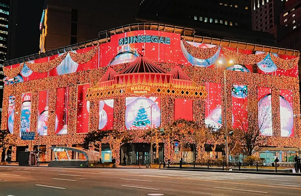 Famous festive Christmas media facade light show on the exterior of Shinsegae Department Store Main Branch in Seoul.